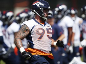 Denver Broncos defensive end Derek Wolfe takes part in a drill during an NFL football minicamp session Tuesday, May 22, 2018, at the team's headquarters in Englewood, Colo.