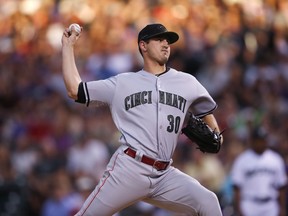 Cincinnati Reds starting pitcher Tyler Mahle delivers a pitch to Colorado Rockies' Charlie Blackmon in the third inning of a baseball game Saturday, May 26, 2018, in Denver.