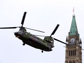 A Canadian Forces CH-147 Chinook helicopter prepares to land on Parliament Hill in Ottawa Thursday May 8, 2014. The Trudeau government is keeping the door open to sending more helicopters to Mali to ensure the Canadian Forces can provide round-the-clock medical evacuations in what is expected to be a harsh operating environment.