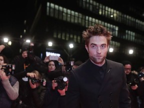 Robert Pattinson poses at the premier of the film Damsel during the 68th edition of the International Film Festival Berlin, Berlinale, in Berlin, Germany, Friday, Feb. 16, 2018. Nova Scotia says it has given more than $1.6 million to a Robert Pattinson movie filmed near Yarmouth, N.S.