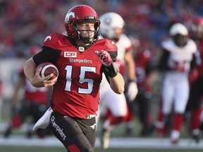 Calgary Stampeders' Andrew Buckley (15) runs for a touchdown in second half CFL action against the Ottawa Redblacks, in Calgary, Thursday, June 29, 2017. Calgary Stampeders quarterback Andrew Buckley has announced his retirement from the Canadian Football League to enter medical school.