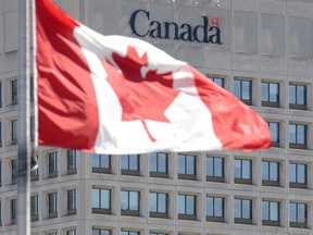 The facade of the headquarters of the Department of National Defence is pictured in Ottawa, on April 3, 2013. The Department of National Defence is looking at ways to better predict and manage when new military equipment will be delivered after reporting fresh delays in 10 major procurement projects.