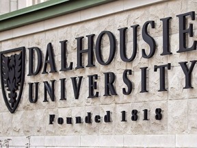 A Dalhousie University sign is seen in Halifax on January 6, 2015. A young woman who was sexually assaulted by a classmate at Dalhousie University in Halifax says she now suffers from post-traumatic stress disorder and has attempted suicide twice in the past year.