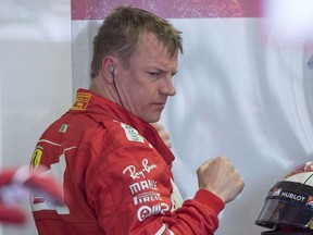 Ferrari driver Kimi Raikkonen (7) of Finland removes his head gear following the third practice session at the Canadian Grand Prix Saturday, June 10, 2017 in Montreal. F1 star Raikkonen has filed a complaint with Montreal police alleging extortion and harassment against a woman who is claiming damages for alleged sexual assault at a Montreal bar in 2016.THE CANADIAN PRESS/Paul Chiasson