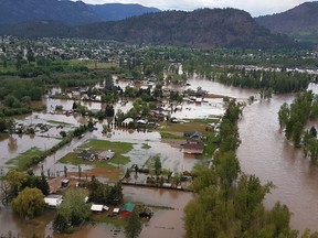 Flooding is seen in Grand Forks B.C. in this undated handout photo. Torrential rains that pushed southern British Columbia waterways to flood stage have eased, but officials warn the new threat of unseasonable heat could rapidly melt snowpacks, adding to already swollen rivers.