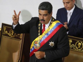 Venezuela's President Nicolas Maduro gestures to members of the Constituent Assembly during a ceremony to recognize him as the winner of the presidential election in Caracas, Venezuela, Thursday, May 24, 2018. Global Affairs says Canada is adding more Venezuelans to its sanctions list.Another 14 individuals have been added to the list of people who Canada says are among those responsible for the deterioration of democracy in that country under the regime of Nicola Maduro.