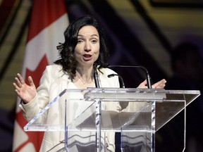 Bloc Quebecois Leader Martine Ouellet jokes during her speech at the Parliamentary Press Gallery Dinner at the Museum of History in Gatineau, Quebec on Saturday, May 26, 2018. Ouellet is facing more stiff opposition as Bloc Quebecois members get ready to vote on her leadership.THE CANADIAN PRESS/Justin Tang