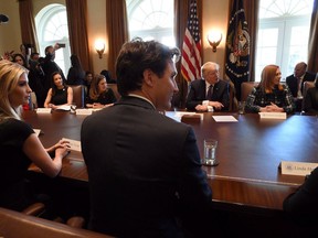 Prime Minister Justin Trudeau participates in a roundtable discussion with female executives, including Ivanka Trump, and U.S. President Donald Trump, at the White House, in Washington, D.C., on Monday, Feb. 13, 2017. A cross-border women's business group says companies controlled by women should get lower tax rates.