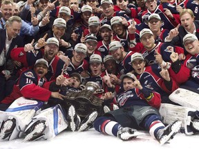 Members of the Windsor Spitfires celebrate after defeating the Erie Otters to win the Memorial Cup in Windsor, Ont., on Sunday, May 28, 2017. The Regina Pats will try to emulate what the Spitfires did last year ??? claiming Memorial Cup glory after being eliminated in the first round of the playoffs.THE CANADIAN PRESS/Adrian Wyld