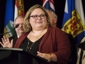 Alberta Health Minister Sarah Hoffman answers questions during a federal, provincial and territorial health ministers' meeting in Toronto on Tuesday, October 18, 2016. The Alberta legislature has passed a bill that bans protesters from standing, demonstrating, or taking video or pictures within at least 50 metres of an abortion clinic.
