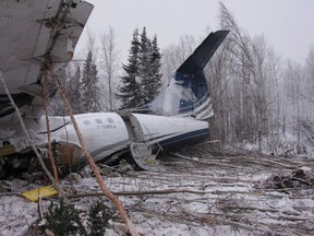 The wreckage of an aircraft is seen near Fond du Lac, Sask. on Thursday, December 14, 2017 in this handout photo. The airline that operated the plane that crashed in northern Saskatchewan in December with 25 people on board has been cleared to resume flying passengers.THE CANADIAN PRESS/HO, Transportation Safety Board of Canada *MANDATORY CREDIT*