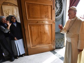 Pope Francis greets faithful as he arrives at the Madonna del Divino Amore Sanctuary (Our Lady of Devine Love) for the recital of the Holy Rosary at the beginning of the Marian month, the month dedicated by the Catholic Church to the Virgin Mary, in Rome, Tuesday, May 1, 2018. MPs on all sides of the house voted Tuesday to extend a formal invitation to Pope Francis to apologize in person to Indigenous Peoples for decades of abuse meted out in residential schools across Canada.