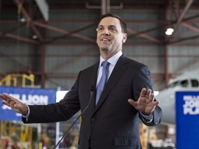 Ontario PC Leader Tim Hudak addresses the media in Mississauga, Ontario on Thursday, June 12, 2014. The president of Toronto's real estate board warned leaders of the Ontario Real Estate Association, headed by a former Progressive Conservative leader, to "stay in their lane" in an emphatic letter that lays out concerns that the provincial organization is stoking fears about the housing market and becoming too political.