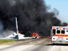 Flames and smoke rise from an Air National Guard C-130 cargo plane after it crashed near Savannah, Ga., on May 2, 2018.