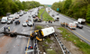 Emergency personnel examine a school bus after it collided with a dump truck, killing two people, on Interstate 80 in Mount Olive, N.J., May 17, 2018.
