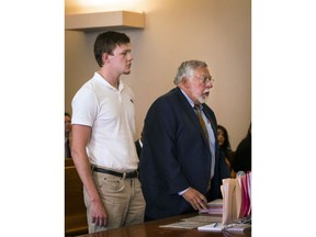 Ryan Fish stands with his  lawyer, Paul Chinigo, in Norwich Superior Court on Tuesday, May 8, 2018 in Norwich, Conn.  Fish  faces two counts of risk of injury to a child, four counts of second-degree reckless endangerment and one count of second degree breach of peace.