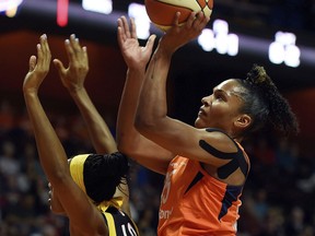 Connecticut Sun forward Alyssa Thomas shoots over Indiana Fever center Kayla Alexander (40) during the first half of a WNBA basketball game Saturday, May 26, 2018, in Uncasville, Conn.