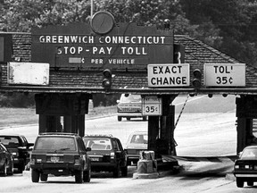 FILE - In this June 1986 file photo, cars travel east bound at the toll plaza on the Merritt Parkway in Greenwich, Conn. A document highlighting aspects of draft legislation to return a form of tolling to Connecticut highways could come up for a vote in the House of Representatives as early as Wednesday, May 2, 2018. (Hearst Connecticut Media via AP, File)