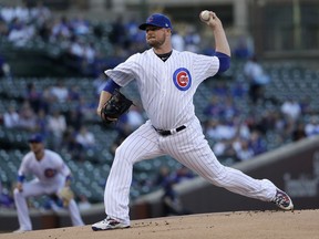 Chicago Cubs starting pitcher Jon Lester delivers during the first inning of a baseball game against the Colorado Rockies Monday, April 30, 2018, in Chicago.