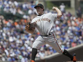 San Francisco Giants starting pitcher Derek Holland delivers during the first inning of a baseball game against the Chicago Cubs Friday, May 25, 2018, in Chicago.