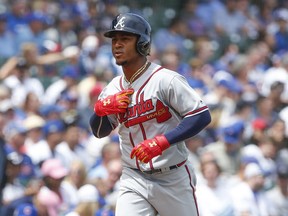 Atlanta Braves' Ozzie Albies rounds the bases after hitting a solo home run off Chicago Cubs' Jose Quintana during the first inning of a baseball game, Monday, May 14, 2018, in Chicago.