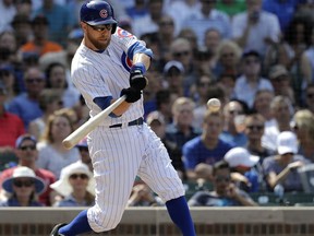 Chicago Cubs' Ben Zobrist hits a two-run double off San Francisco Giants relief pitcher Will Smith during the seventh inning of a baseball game Friday, May 25, 2018, in Chicago. Ian Happ and Javier Baez scored on the play.