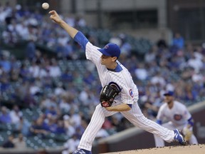 Chicago Cubs starting pitcher Kyle Hendricks delivers during the first inning of the team's baseball game against the Colorado Rockies on Tuesday, May 1, 2018, in Chicago.