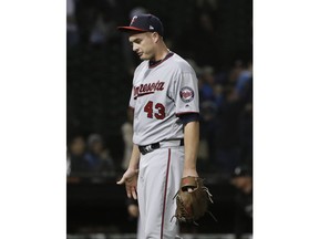 Minnesota Twins relief pitcher Addison Reed reacts after Chicago White Sox's Trayce Thompson hit a game-winning solo home run during the ninth inning of a baseball game Thursday, May 3, 2018, in Chicago. The White Sox won 6-5.