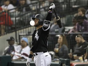 Chicago White Sox catcher Welington Castillo blows a bubble as he waits in the on-deck circle during the sixth inning of the team's baseball game against the Baltimore Orioles on Wednesday, May 23, 2018, in Chicago.