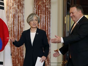South Korean Foreign Minister Kang Kyung-wha, left, and Secretary of State Mike Pompeo arrive for a media availability at the State Department, Friday, May 11, 2018 in Washington.