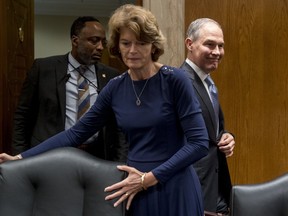 Environmental Protection Agency Administrator Scott Pruitt, accompanied by Chairman Lisa Murkowski, R-Alaska, center, and a member of his security, left, arrives to testify before a Senate Appropriations subcommittee on budget on Capitol Hill in Washington, Wednesday, May 16, 2018. Pruitt goes before a Senate panel Wednesday as he faces a growing number of federal ethics investigations over his lavish spending on travel and security.