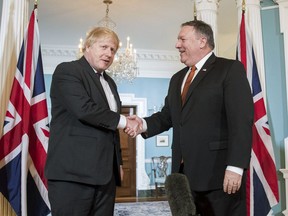 Secretary of State Mike Pompeo shakes hands with UK Foreign Secretary Boris Johnson at the State Department, Monday, May 7, 2018, in Washington.
