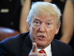 President Donald Trump speaks to media as he meets with crew and passengers of Southwest Airlines Flight 1380 in the Oval Office of the White House in Washington, Tuesday, May 1, 2018.