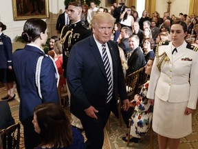 President Donald Trump walks from the East Room after presenting Mandy Manning, a teacher at the Newcomer Center at Joel E. Ferris High School in Spokane, Wash., with the National Teacher of the Year award at the White House in Washington, Wednesday, May 2, 2018.