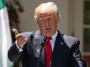 President Donald Trump speaks during a news conference with Nigerian President Muhammadu Buhari in the Rose Garden of the White House in Washington, Monday, April 30, 2018.