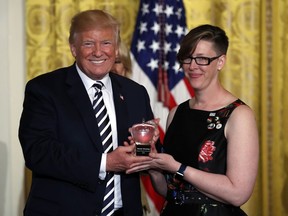 President Donald Trump presents the National Teacher of the Year award to Mandy Manning, a teacher at Newcomer Center at Joel E. Ferris High School in Spokane, Wash.,  in the East Room of the White House in Washington, Wednesday, May 2, 2018.