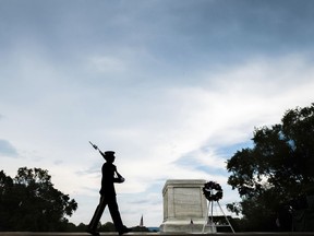 A member of the U.S. Army 3rd Infantry Regiment walks his post in front of The Tomb of the Unknown Soldier in Arlington National Cemetery during the Memorial Day weekend in Arlington, Va., Sunday, May 27, 2018.