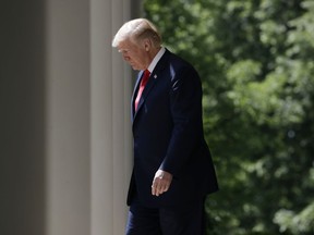 U.S. President Donald Trump walks out to speak during a 'National Day of Prayer' event in the Rose Garden of the White House, Thursday, May 3, 2018, in Washington.