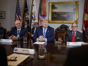 President Donald Trump speaks during a meeting with automotive executives in the Roosevelt Room of the White House, Friday, May 11, 2018, in Washington. From left, Environmental Protection Agency administrator Scott Pruitt, Ford CEO James Hackett, Trump, and White House chief economic adviser Larry Kudlow.