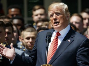 President Donald Trump speaks during a ceremony to present the Commander in Chief trophy to the U.S. Military Academy football team in the Rose Garden of the White House, Tuesday, May 1, 2018, in Washington.