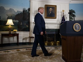 President Donald Trump arrives to deliver a statement on the Iran nuclear deal from the Diplomatic Reception Room of the White House, Tuesday, May 8, 2018, in Washington.