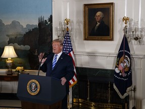 President Donald Trump delivers a statement on the Iran nuclear deal from the Diplomatic Reception Room of the White House, Tuesday, May 8, 2018, in Washington. Trump says the United States is withdrawing from the Iran nuclear deal, which he called "defective at its core."