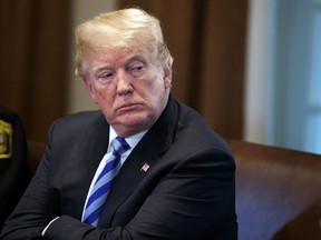 President Donald Trump listens during a roundtable on immigration policy in California, in the Cabinet Room of the White House, Wednesday, May 16, 2018, in Washington.