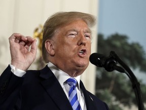 President Donald Trump delivers a statement on the Iran nuclear deal from the Diplomatic Reception Room of the White House, Tuesday, May 8, 2018, in Washington.