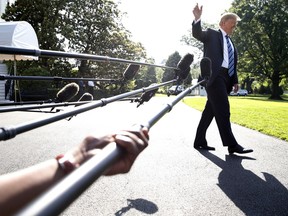 President Donald Trump waves while walking away after speaking to the media, as he walks to the Marine One helicopter Friday, May 25, 2018, on the South Lawn of the White House in Washington.  Trump is traveling to Annapolis to address the U.S. Naval Academy graduation ceremonies.