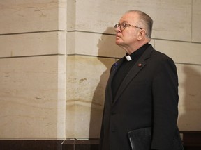 Rev. Patrick Conroy, chaplain of the House of Representatives, waits to speak at memorial service for U.S. Capitol Police officers who lost their lives in the line on duty, on Capitol Hill in Washington, Tuesday, May 8, 2018.   House Speaker Paul Ryan has met with the House chaplain he ousted last month, then reinstated after the chaplain said a Ryan aide told him it might be time to put a non-Catholic in the job.  Ryan told reporters he and the Rev. Patrick Conroy talked about how to improve pastoral services over coffee Tuesday.