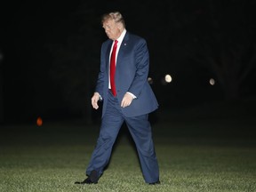 President Donald Trump walks across the South Lawn of the White House in Washington, Thursday, May 10, 2018, as he returns from nearby Andrews Air Force Base, Md., following an evening trip to Elkhart, Ind., for a campaign rally.