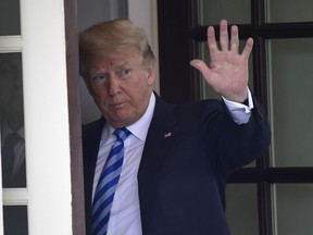 President Donald Trump waves to Uzbek President Shavkat Mirziyoyev as he leaves following a visit to the White House in Washington, Wednesday, May 16, 2018.