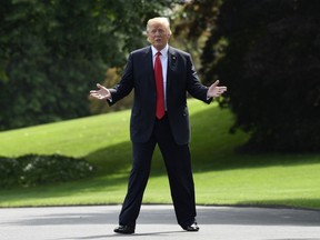President Donald Trump gestures as he walks toward Marine One on the South Lawn of the White House in Washington, Tuesday, May 29, 2018, as he heads to Nashville for a rally.