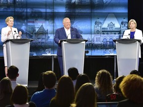 Ontario Liberal Leader Kathleen Wynne, left to right, Ontario Progressive Conservative Leader Doug Ford and Ontario NDP Leader Andrea Horwath participate during the third and final televised debate of the provincial election campaign in Toronto, Sunday, May 27, 2018.